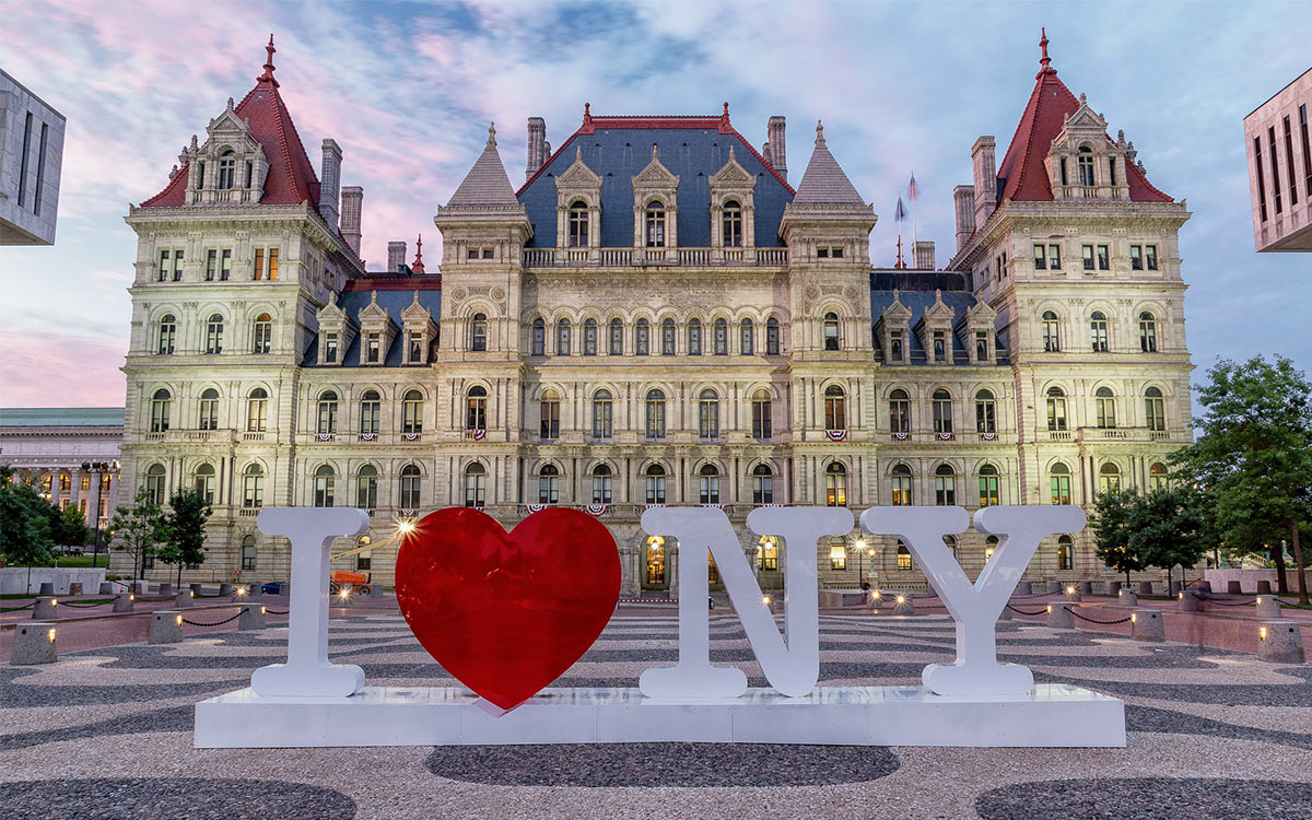 new york state capitol building with i love ny sign in front