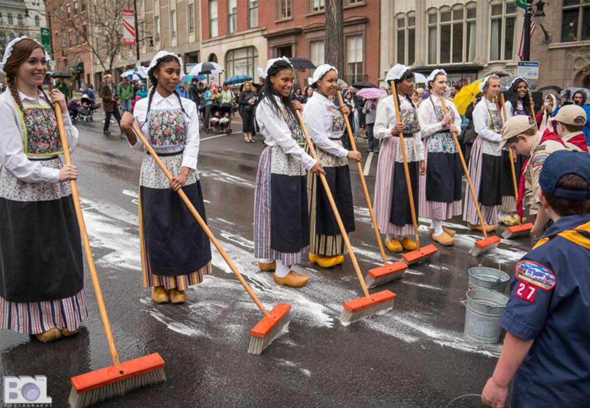 women dressed for traditional dutch street scrubbing