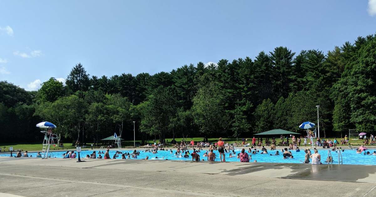 people in an outdoor swimming pool