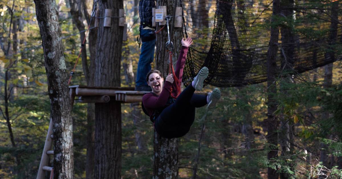 woman ziplines