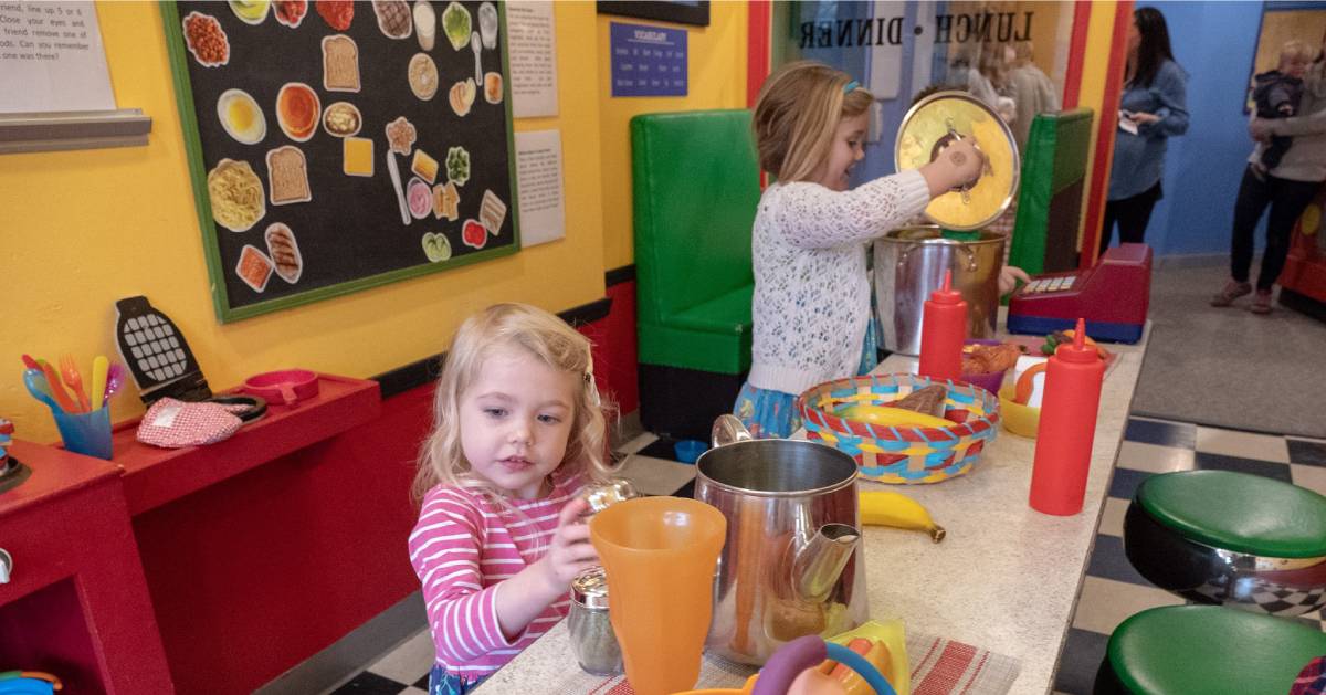 children playing in a museum