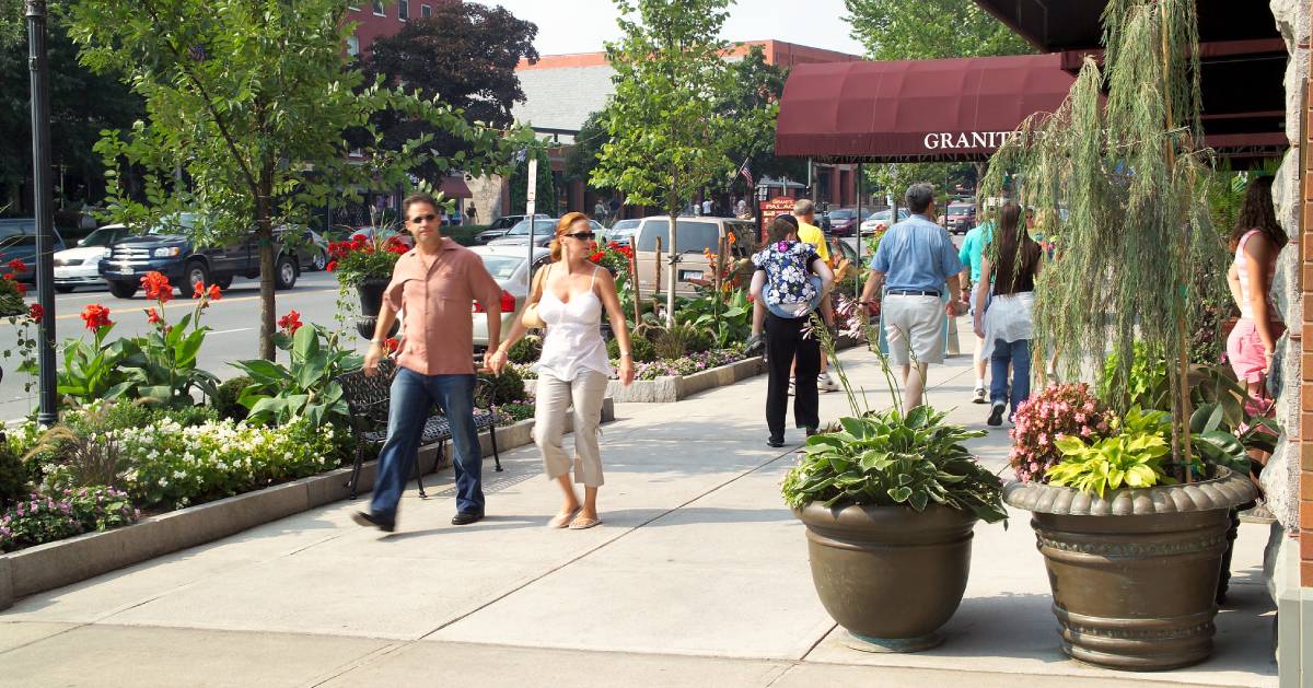 people walking on city sidewalk