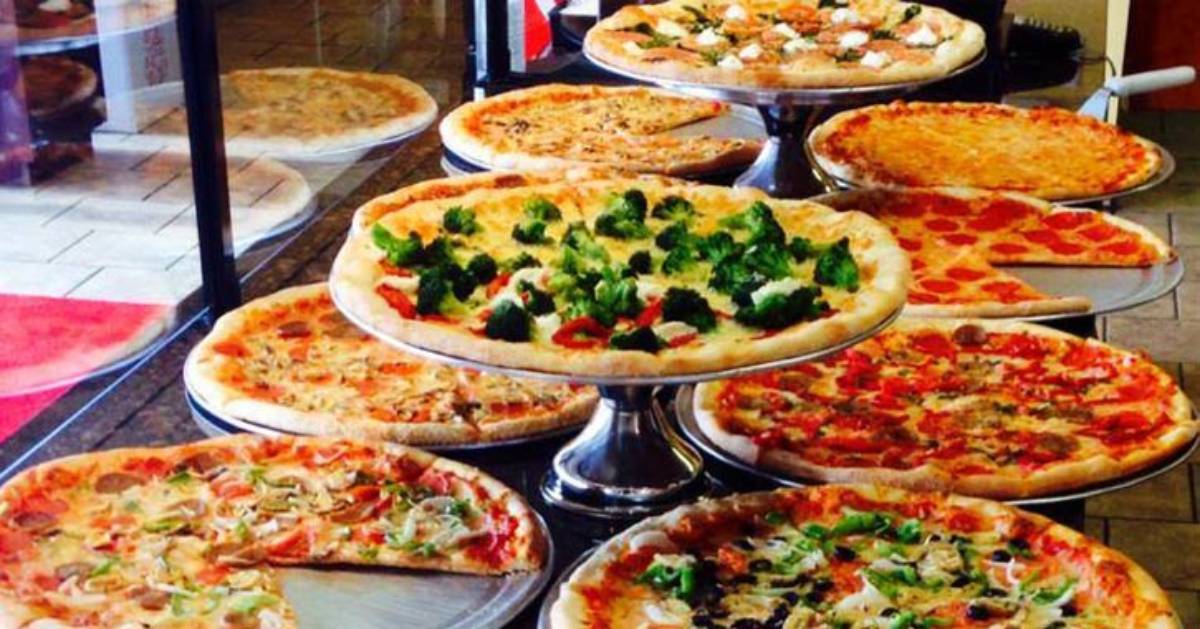 pizzas on display in a shop