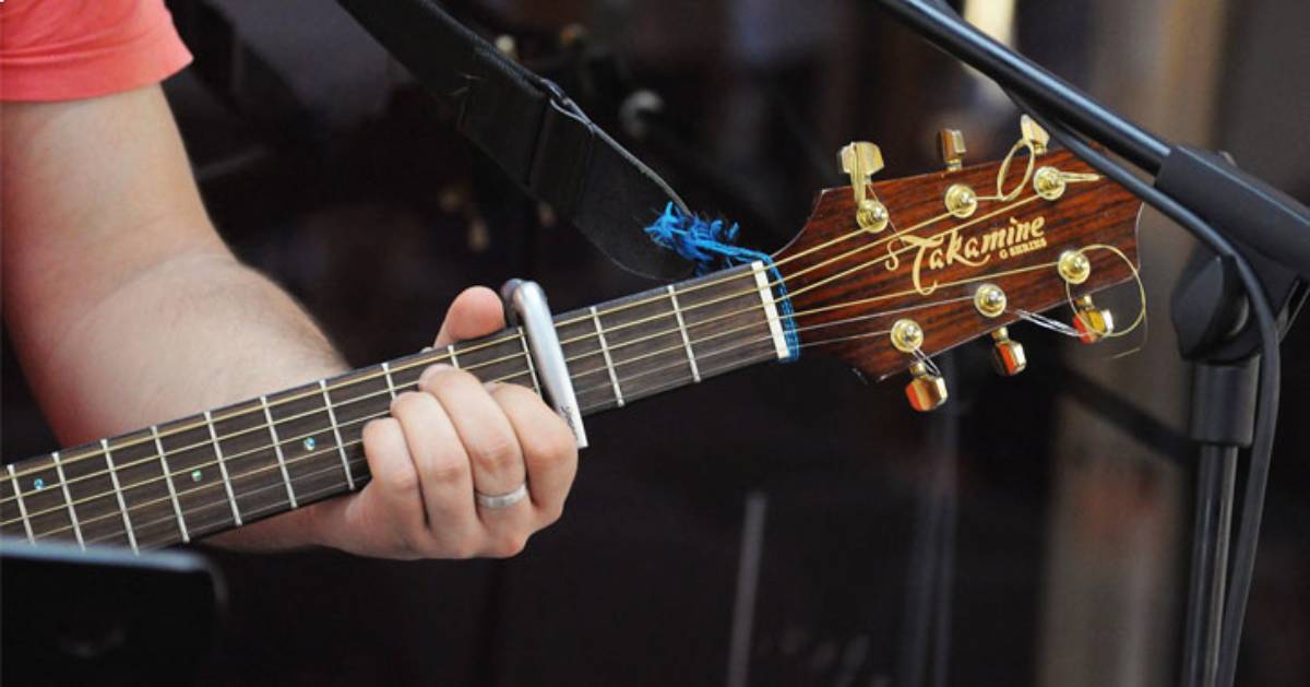 person playing a guitar