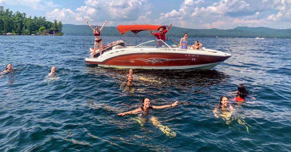 people on and near a boat in the water