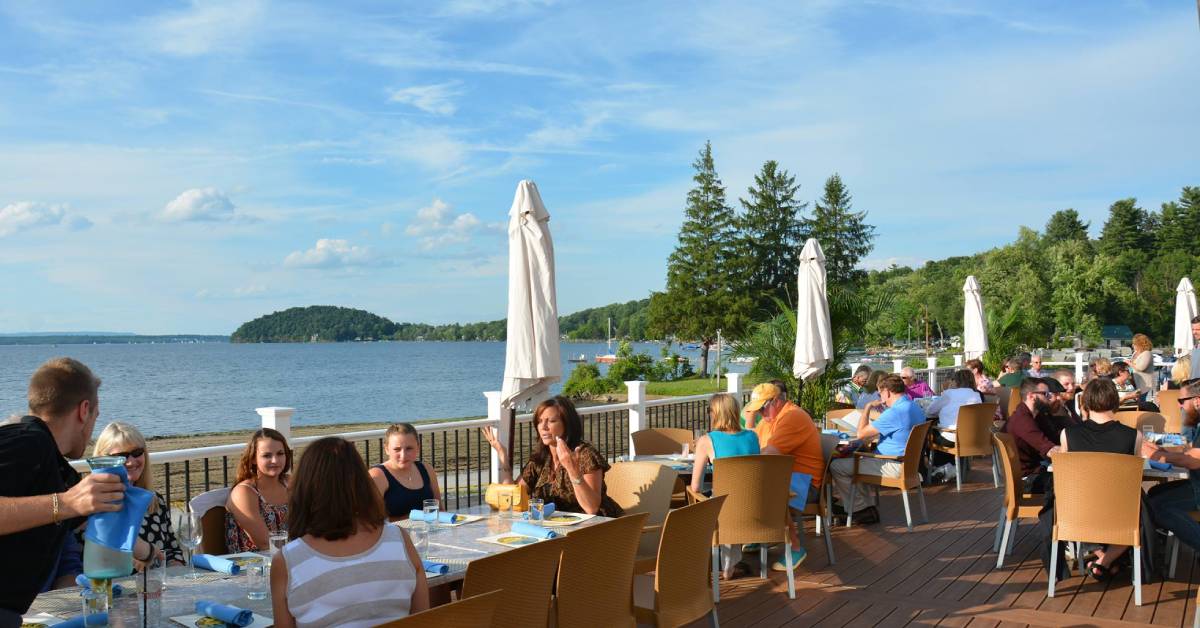 people dining on the lakeside patio at dock brown's