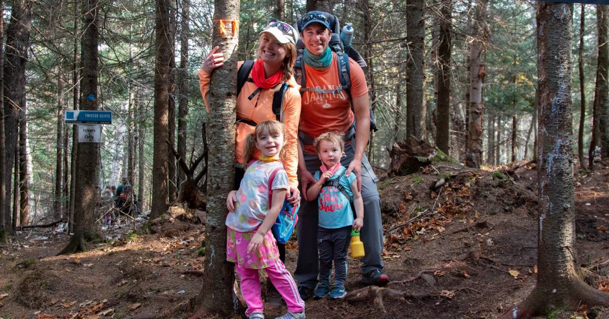family of four hikers