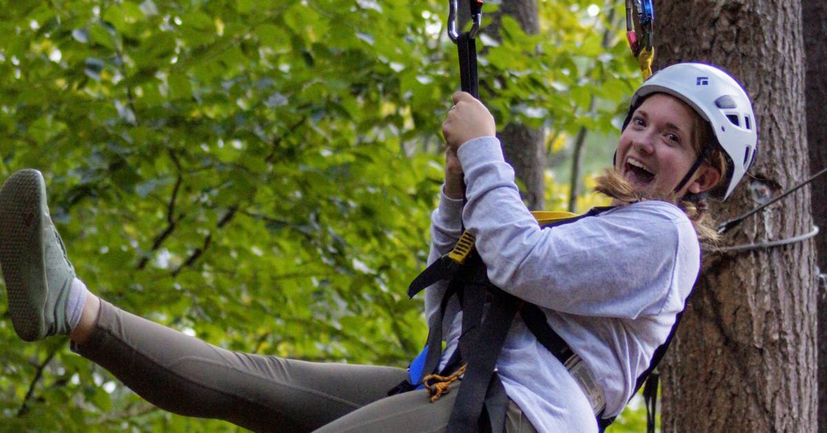 happy woman ziplines