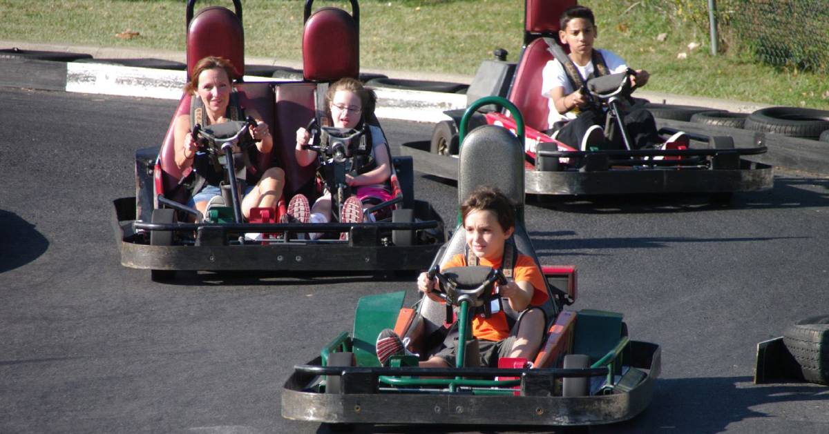 people riding in go karts