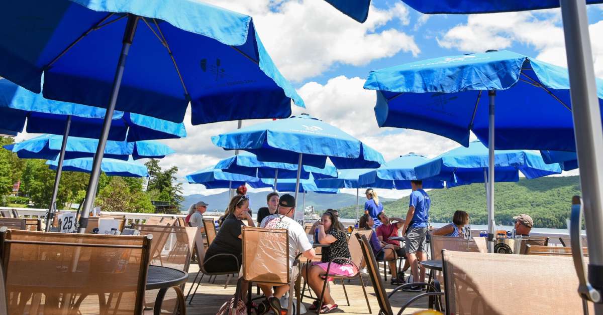 a family on the patio at lake george beach club