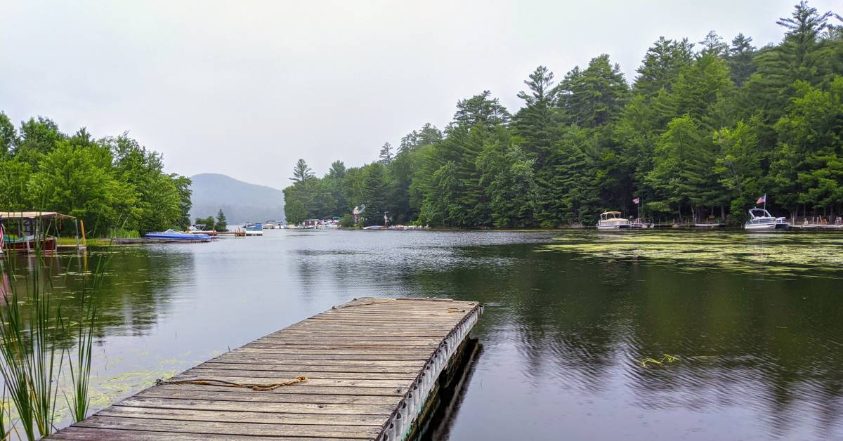 view of lake and boats from dock