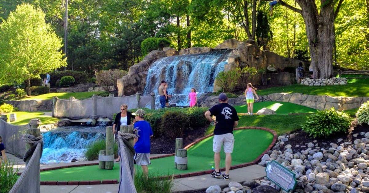 families playing mini golf