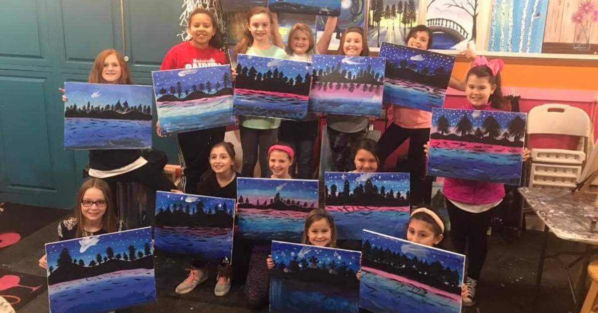 group of girls at a painting party