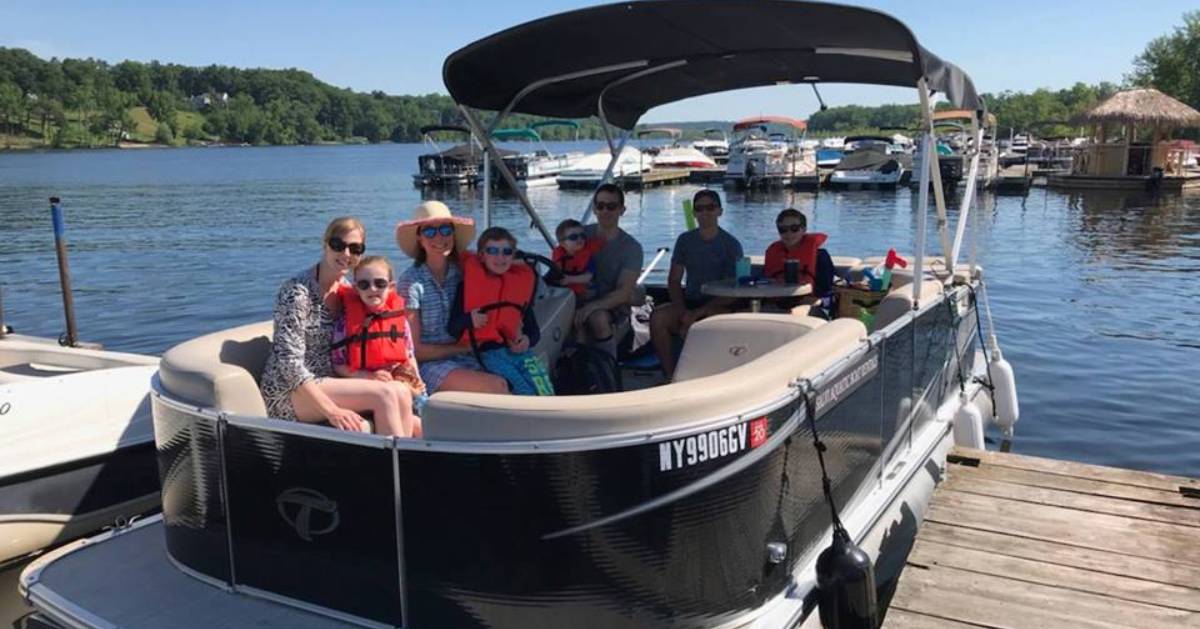 people on a pontoon boat