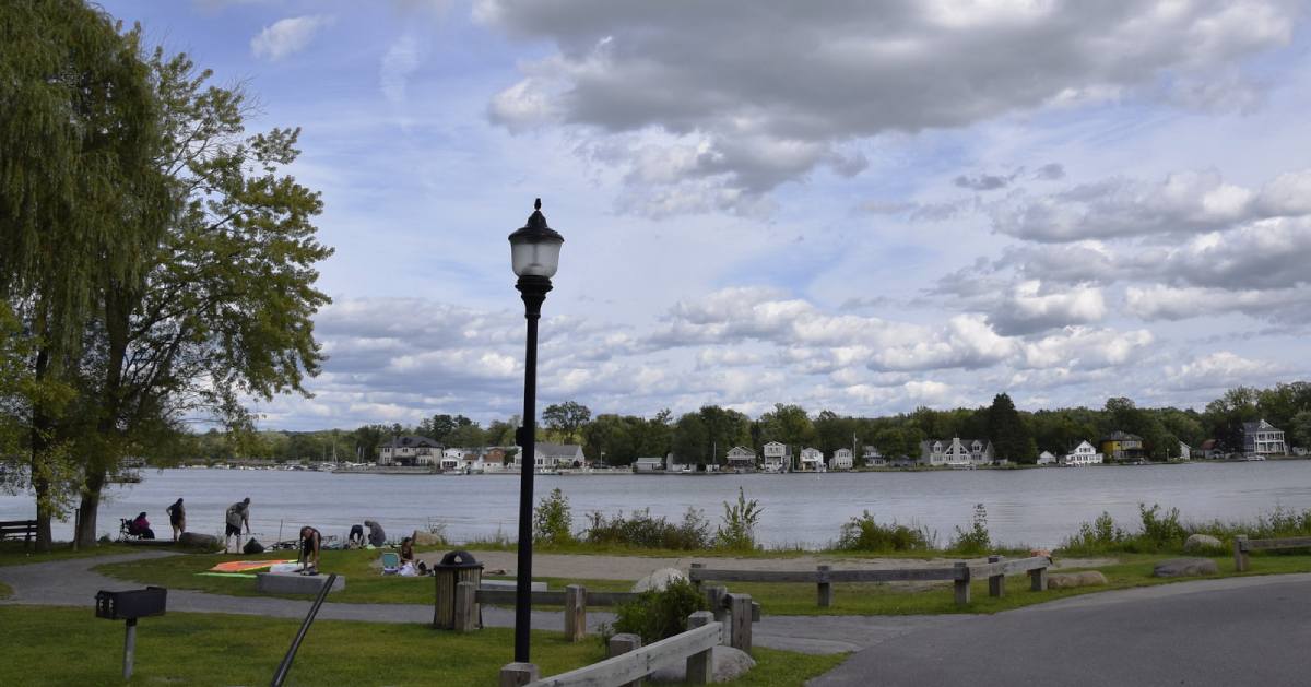 view of a shoreline park by a lake