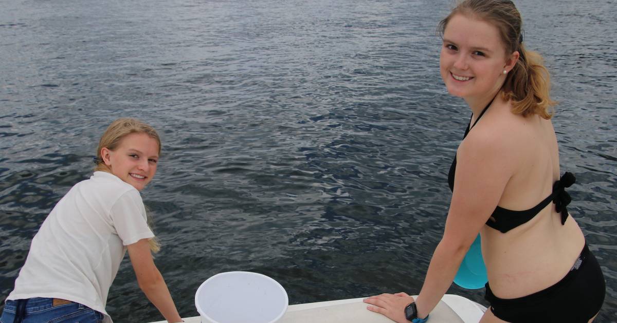 two teen girls on a boat