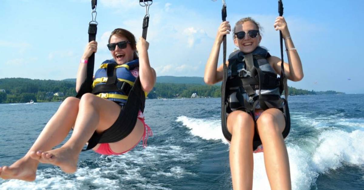 two young girls parasailing
