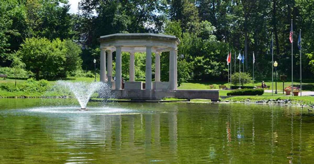 water fountain in a pond and a stone structure