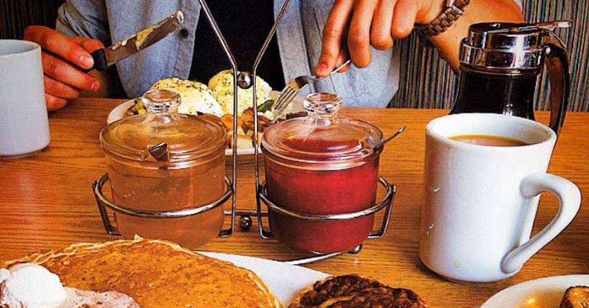 person eating breakfast at a table