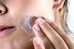 young woman washing face