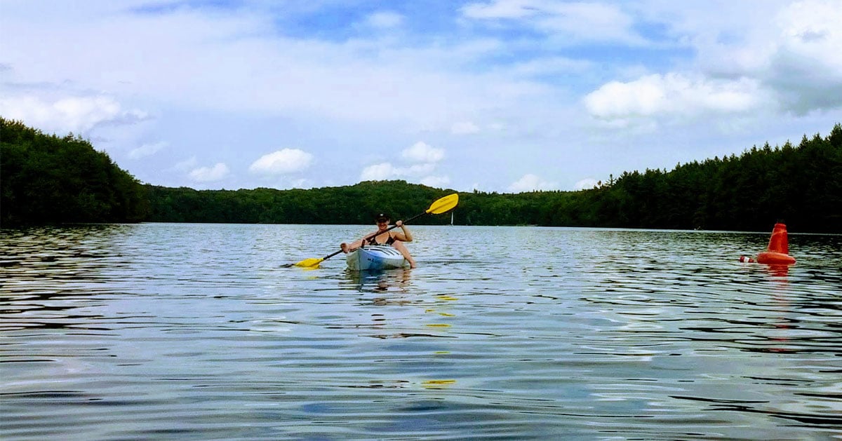 girl paddling in a kayak