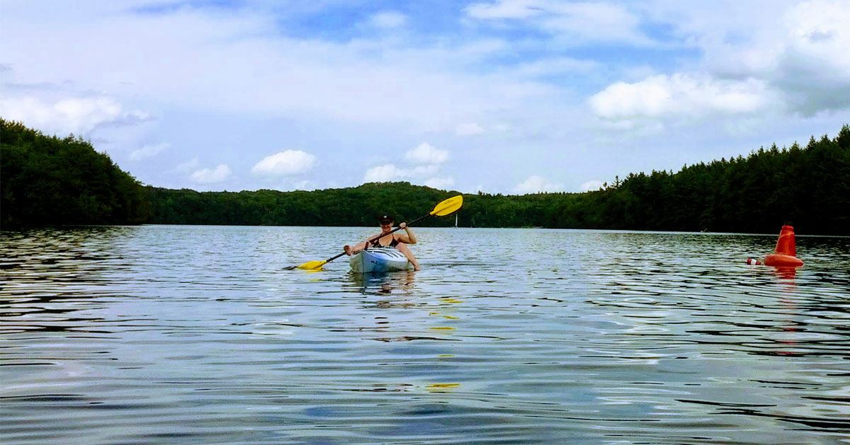 girl paddling in a kayak