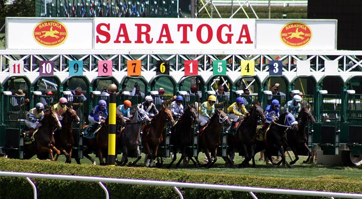 the horses just coming out of the starting gate