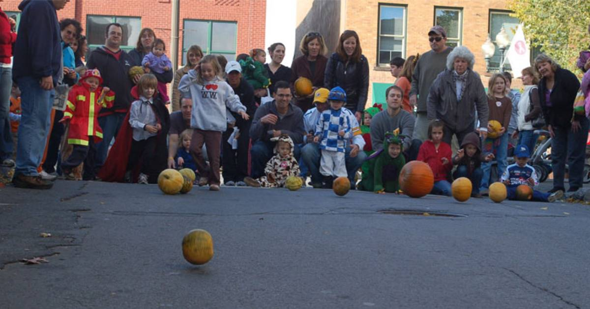 children throwing pumpkins