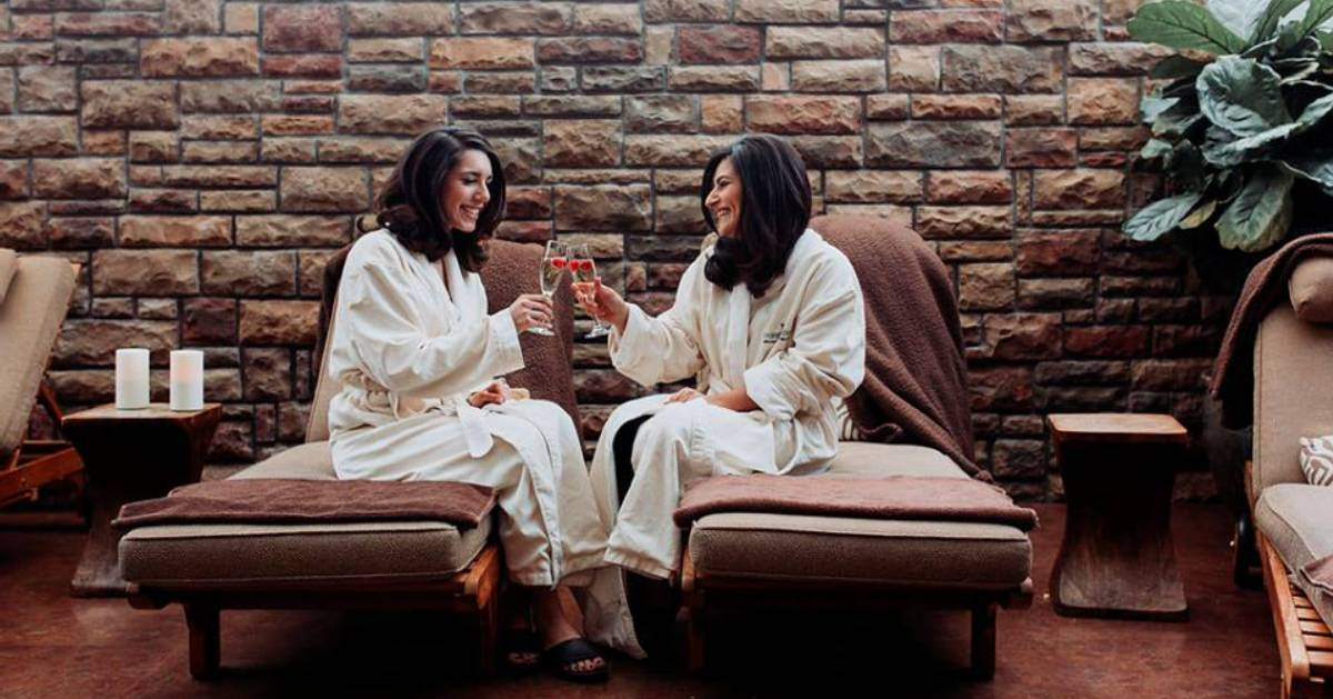 two women cheersing in a spa