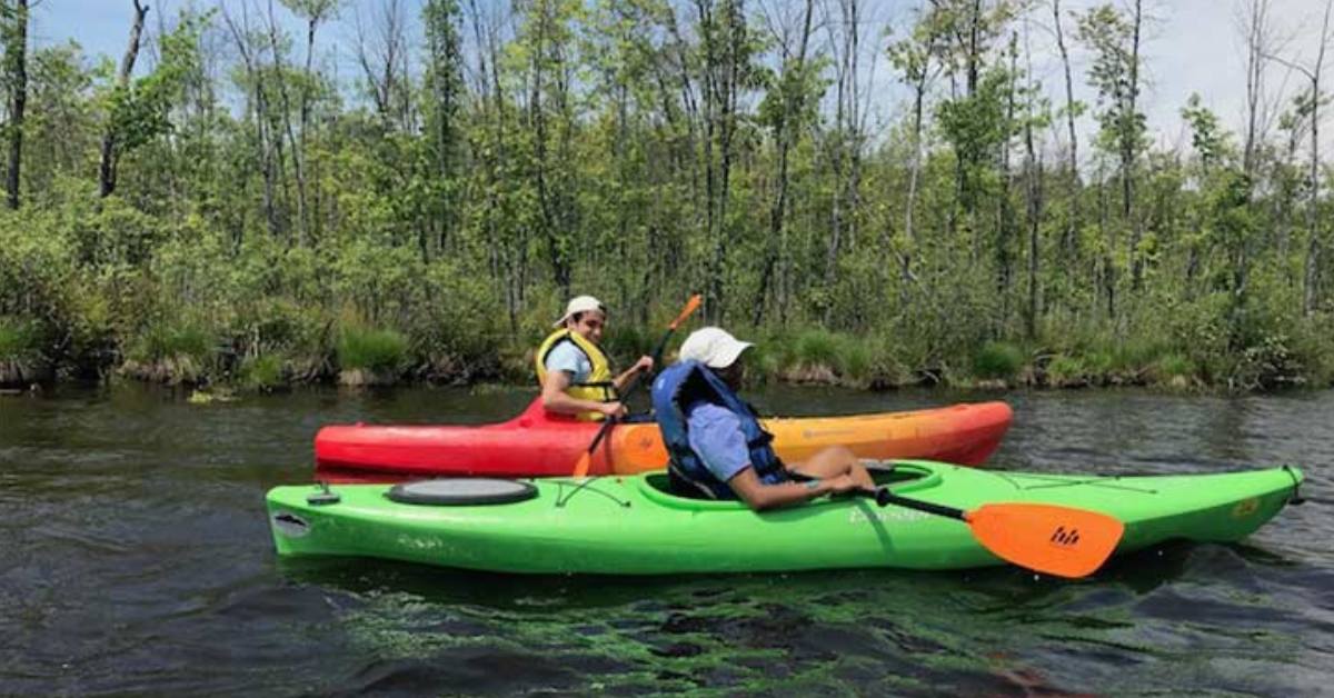 two people kayaking on a river