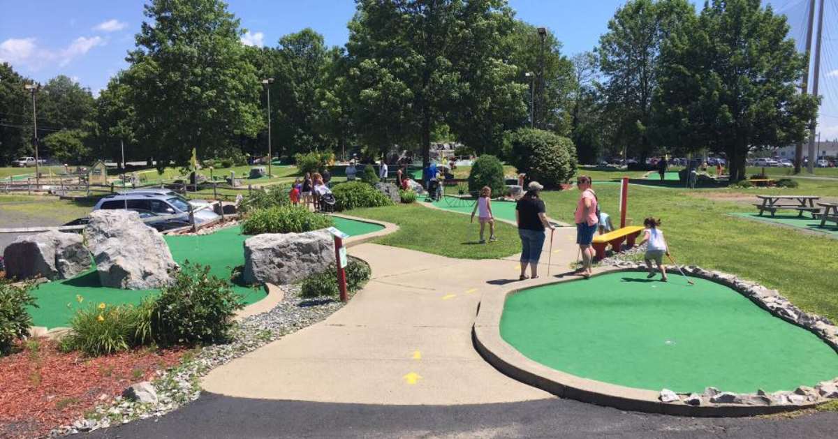 people on a mini golf course