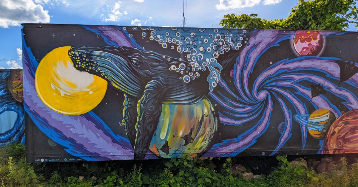 mural with whale and planets
