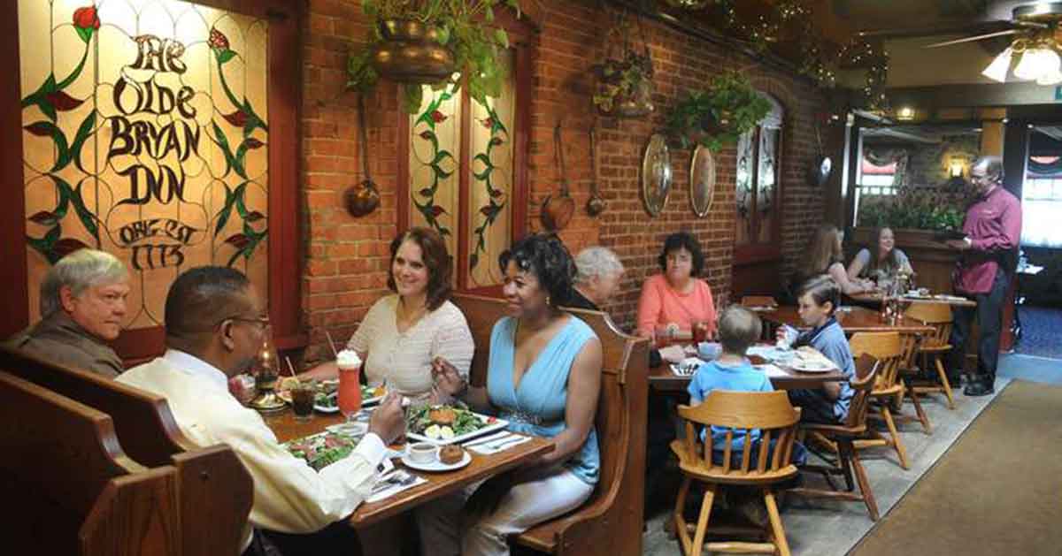 people eating inside the olde bryan inn