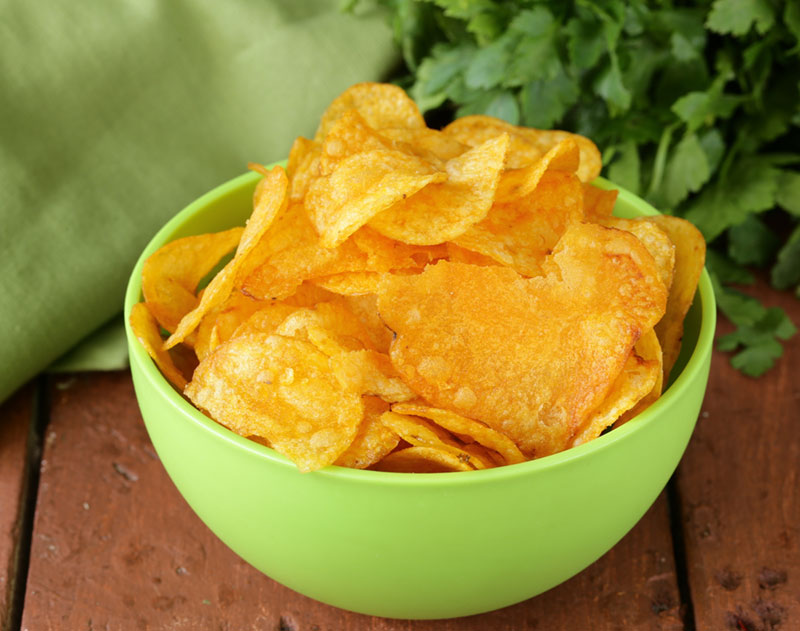 A bowl of kettle cooked potato chips