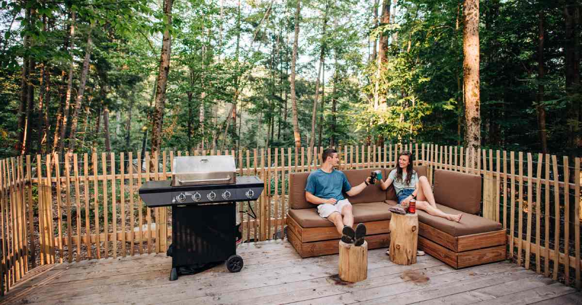 man and woman relaxing on lounge seats on a deck