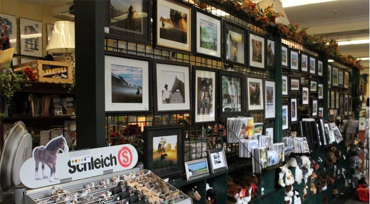 a line up of paintings and other merchandise at a store