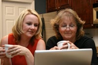 mother and daughter searching the internet