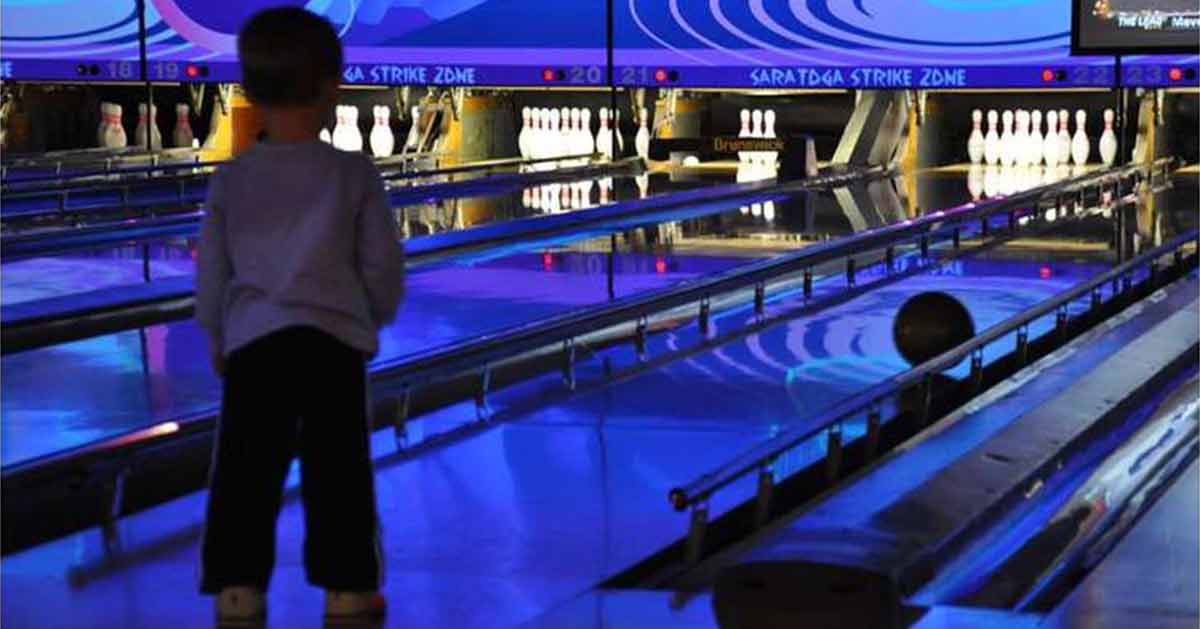 kid bowling at saratoga strike zone