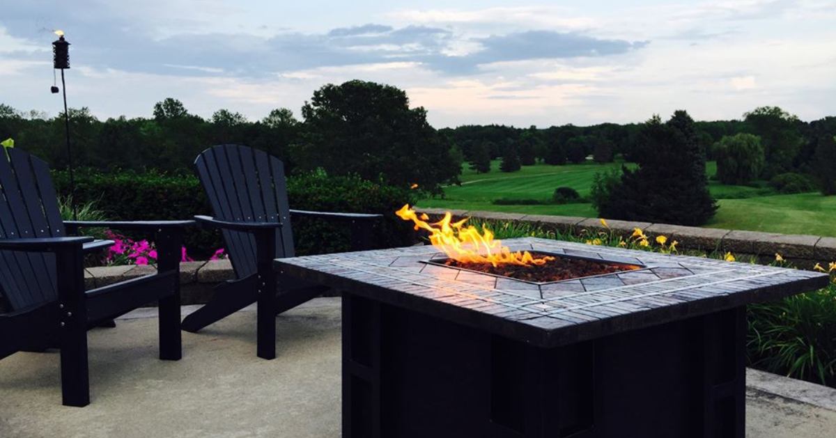 chairs by table with fire pit