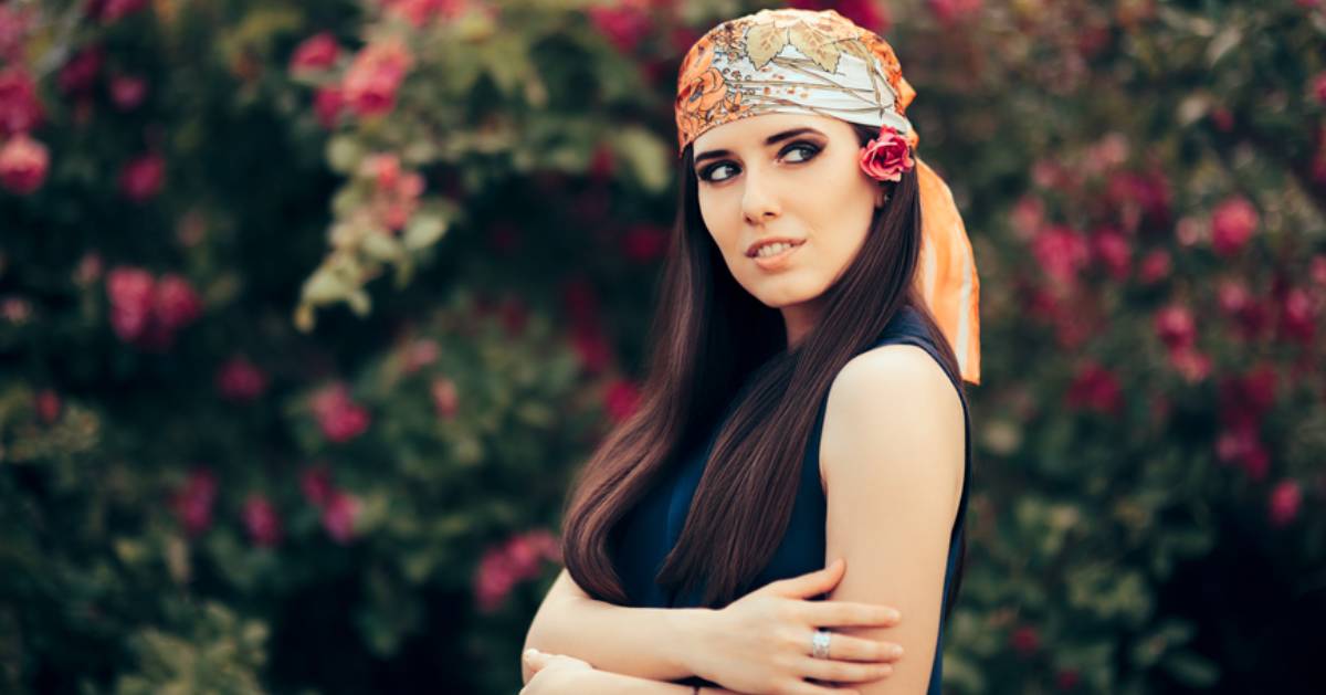 woman outdoors wearing a bandana on her head