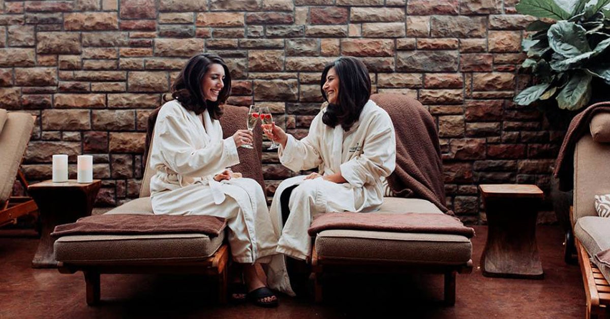 women in a spa cheersing with drinks