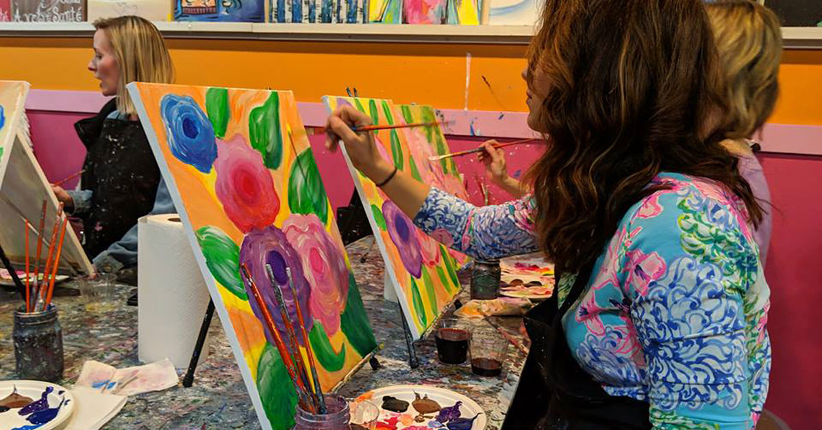 women painting flowers