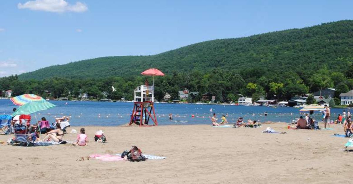 People lounging on a beach on a bright summer day