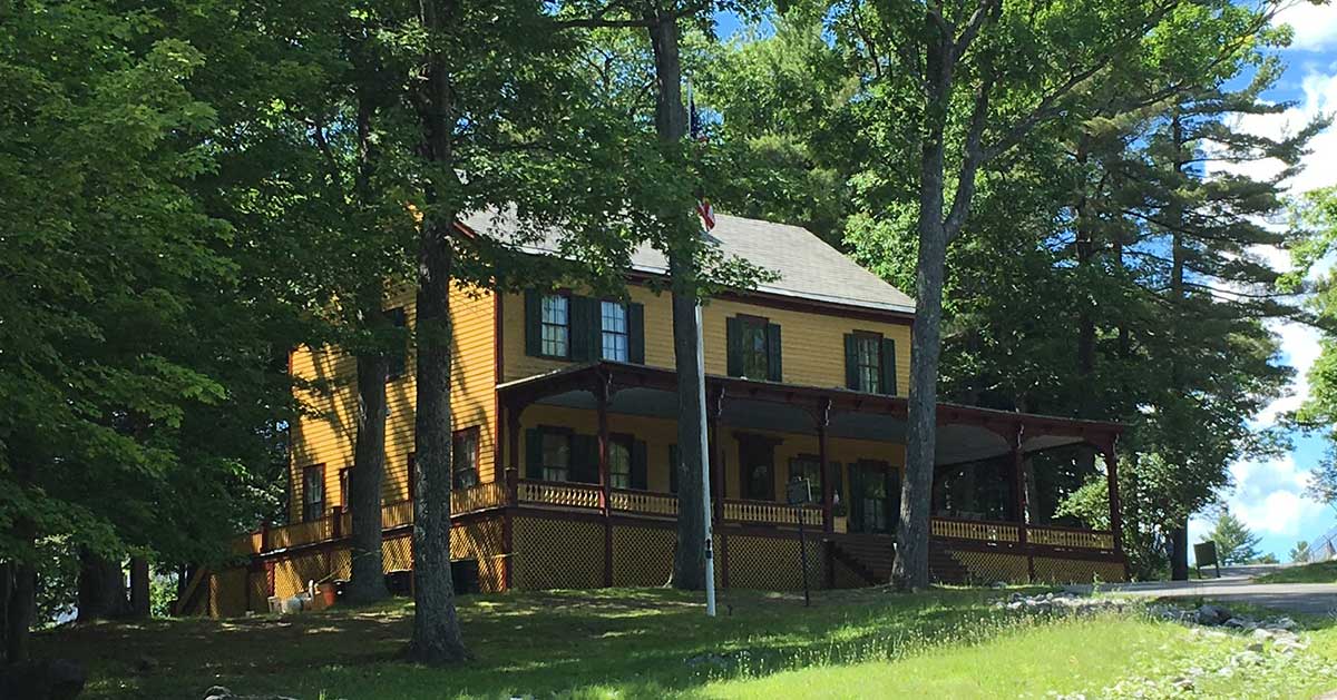 front of grant cottage between trees