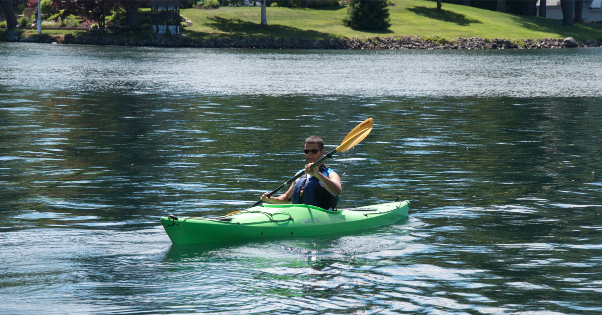 guy paddling on waterway