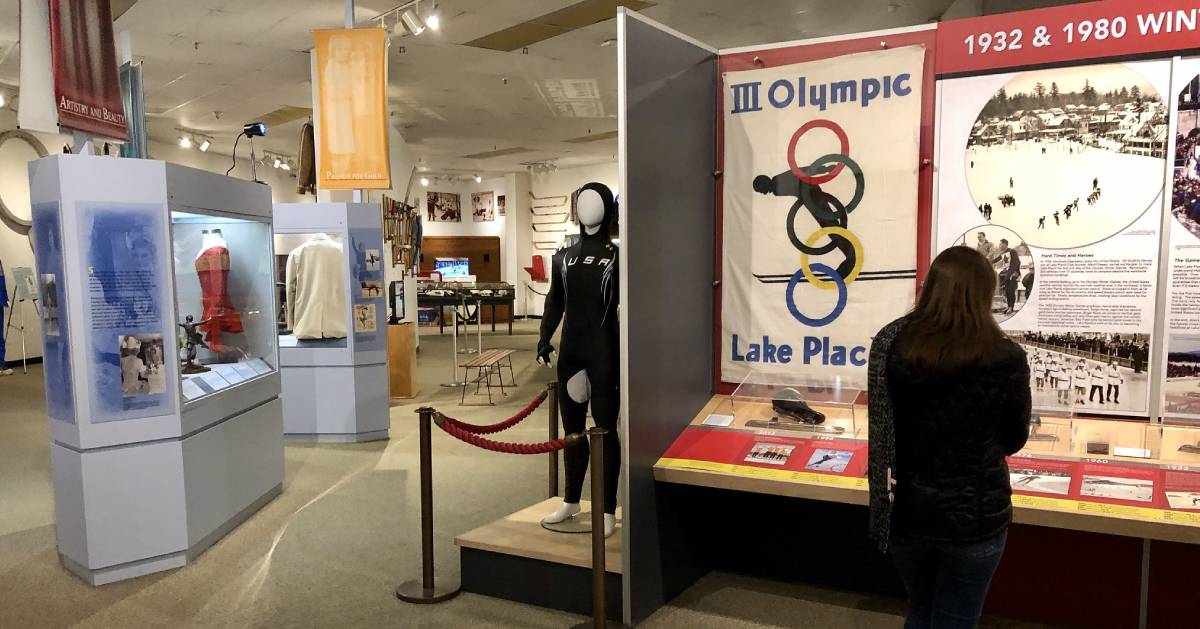 woman looking at exhibits in museum