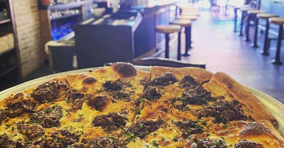 meatball pizza and view of a dining room