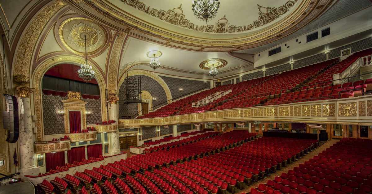 ornate theater with red seats