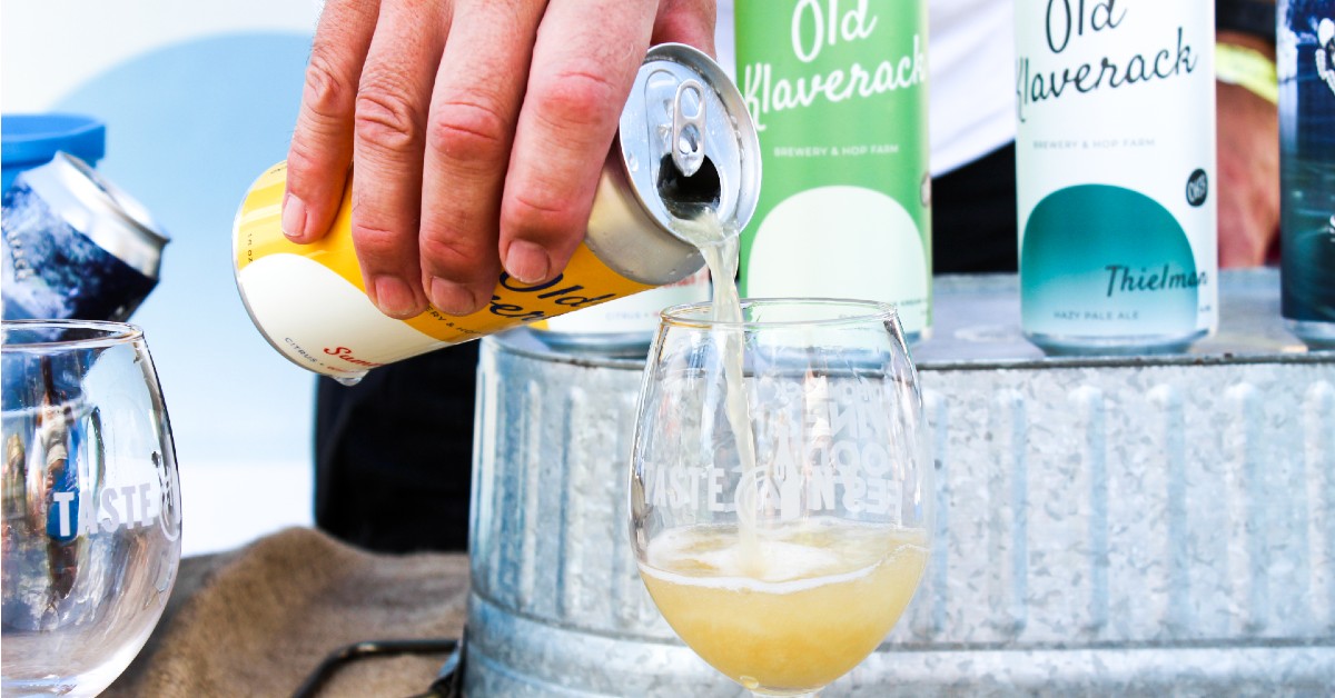 beer being poured into a glass