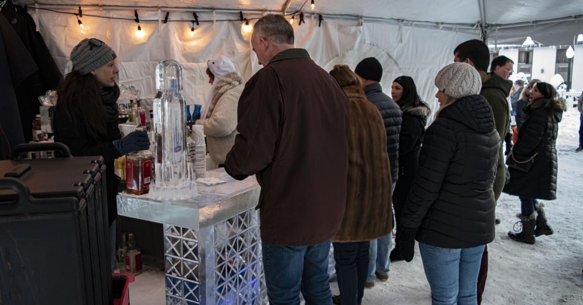 people standing in line at an ice bar